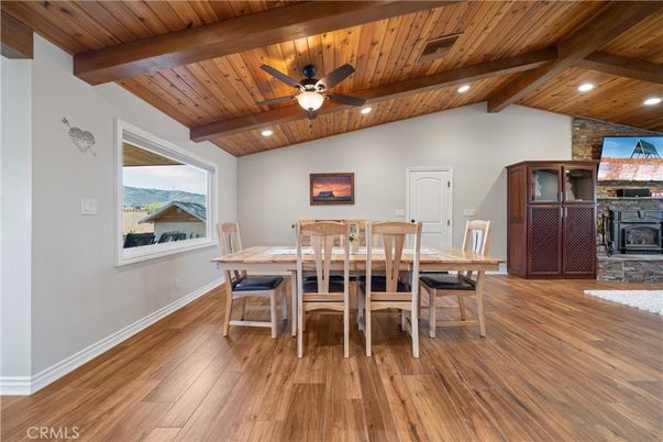 Dining room, Fireplace, Interior, Recessed Lighting, Stone Walls, Wooden Beams, Wooden Ceilings, Wood Texture Flooring