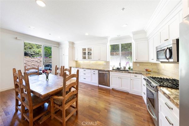 Dining room, Interior, Kitchen, Recessed Lighting, Stainless Steel Appliances, Wood Texture Flooring