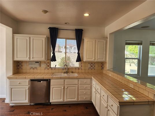 Interior, Kitchen, Recessed Lighting, Tile Countertops, Wood Texture Flooring