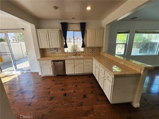 Interior, Kitchen, Recessed Lighting, Tile Countertops, Wood Texture Flooring