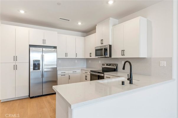 Interior, Kitchen, Recessed Lighting, Stainless Steel Appliances, Wood Texture Flooring
