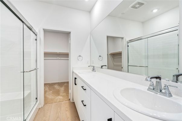 Bathroom, Dual Sink Vanities, Glass Shower, Interior, Recessed Lighting, Walk-in Closets, Wood Texture Flooring
