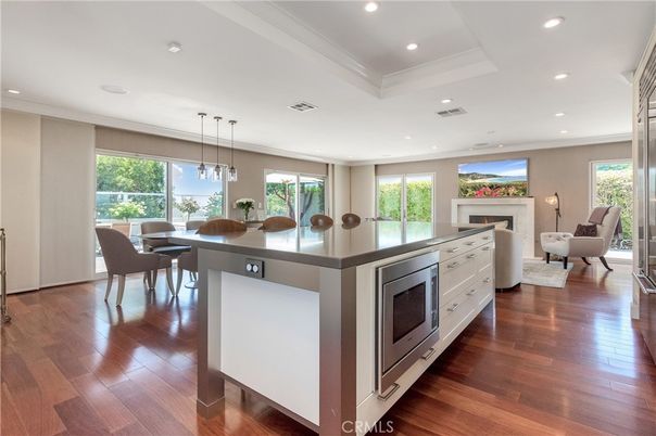 Dining room, Fireplace, Interior, Living room, Pendant Lights, Recessed Lighting, Wood Texture Flooring