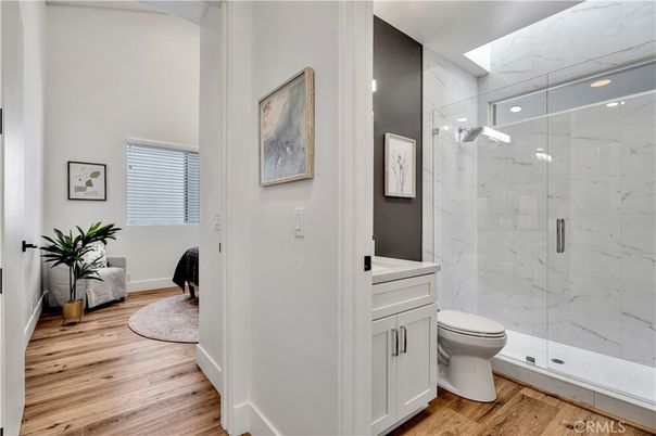 Bathroom, Glass Shower, Interior, Marble Walls, Wood Texture Flooring