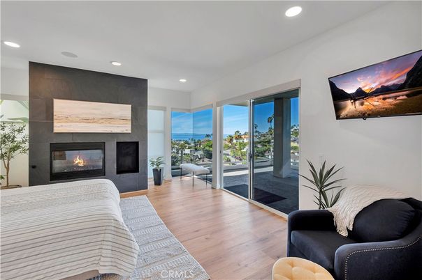 Bedroom, Fireplace, Interior, Recessed Lighting, Water, Wood Texture Flooring