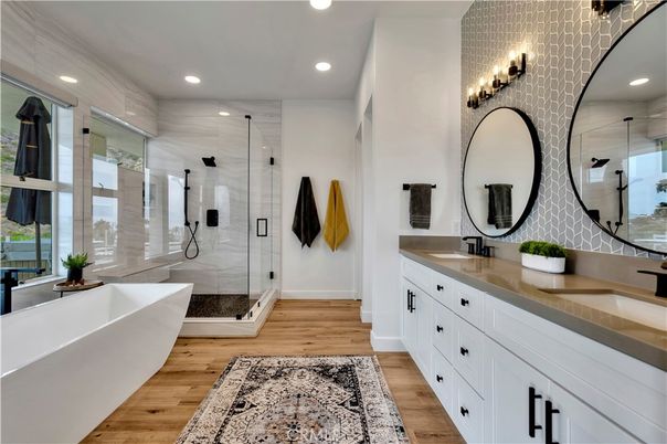 Bathroom, Dual Sink Vanities, Free Standing Baths, Glass Shower, Interior, Recessed Lighting, Wood Texture Flooring