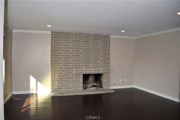 Empty room, Fireplace, Interior, Recessed Lighting, Stone Walls, Wood Texture Flooring