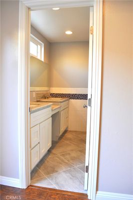 Bathroom, Dual Sink Vanities, Interior, Recessed Lighting, Wood Texture Flooring