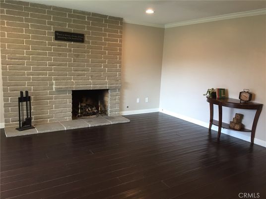 Empty room, Fireplace, Interior, Recessed Lighting, Stone Walls, Wood Texture Flooring