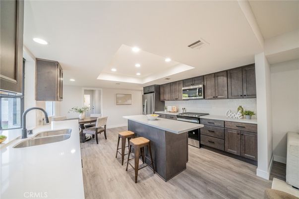 Dining room, Interior, Kitchen, Recessed Lighting, Stainless Steel Appliances, Wood Texture Flooring