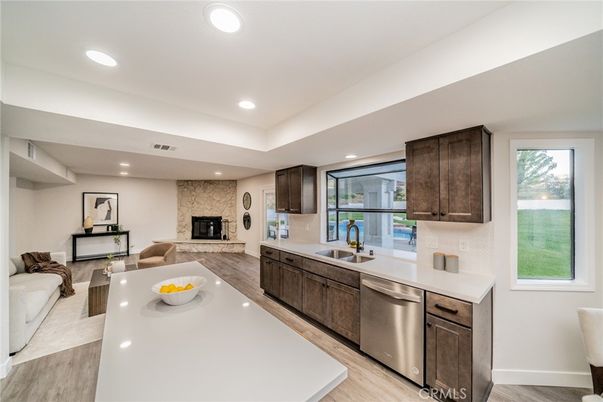 Fireplace, Interior, Kitchen, Living room, Recessed Lighting, Stainless Steel Appliances, Wood Texture Flooring