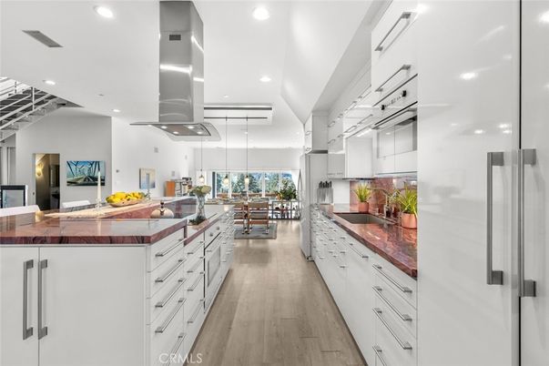 Dining room, Interior, Kitchen, Pendant Lights, Recessed Lighting, Stainless Steel Appliances, Tile Countertops, Wood Texture Flooring