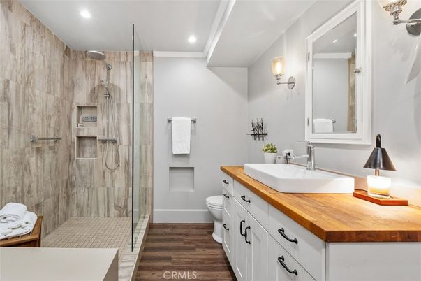 Bathroom, Dual Sink Vanities, Glass Shower, Interior, Recessed Lighting, Wood Texture Flooring