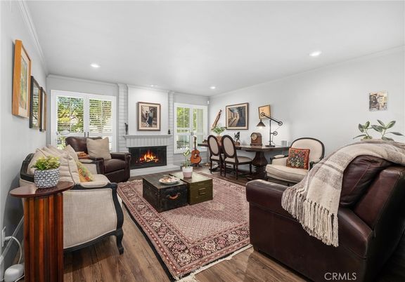 Dining room, Fireplace, Interior, Living room, Recessed Lighting, Wood Texture Flooring