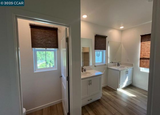Bathroom, Dual Sink Vanities, Interior, Recessed Lighting, Wood Texture Flooring