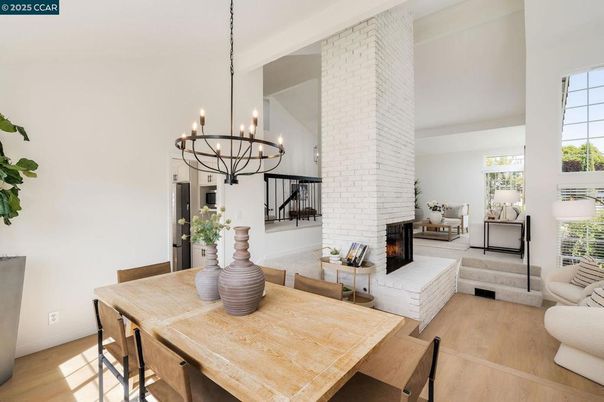 Chandelier, Dining room, Fireplace, Interior, Living room, Stone Walls, Wood Texture Flooring