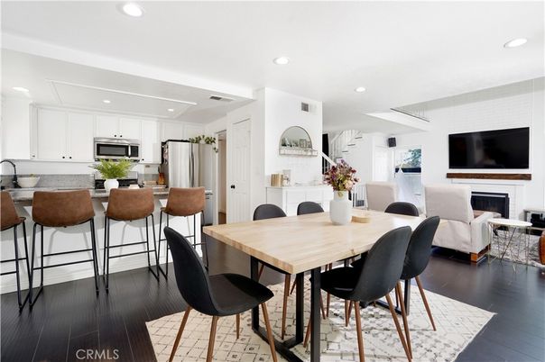 Dining room, Fireplace, Interior, Kitchen, Living room, Recessed Lighting, Stainless Steel Appliances, Wood Texture Flooring