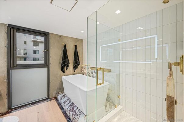 Bathroom, Free Standing Baths, Glass Shower, Interior, Recessed Lighting, Wood Texture Flooring