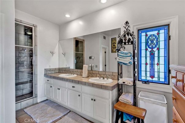 Bathroom, Dual Sink Vanities, Glass Shower, Interior, Recessed Lighting, Tile Countertops