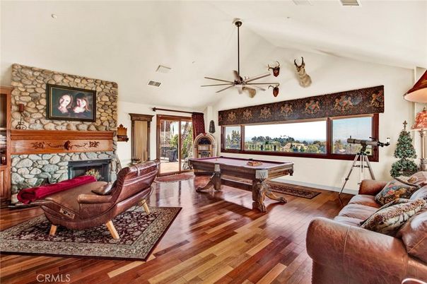Billiard Table, Fireplace, Game Room, Interior, Living room, Stone Walls, Wood Texture Flooring