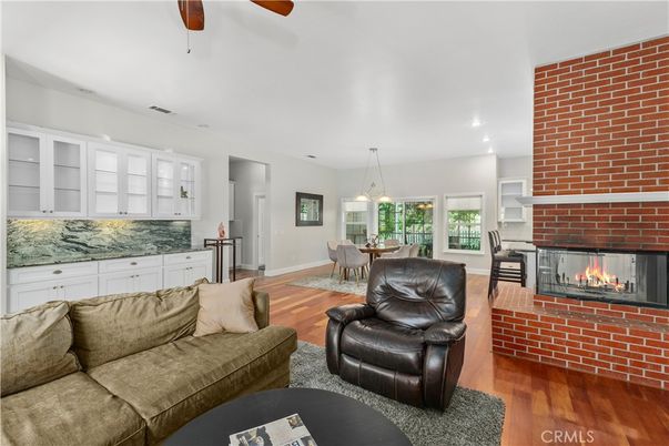 Dining room, Fireplace, Interior, Living room, Pendant Lights, Recessed Lighting, Stone Walls, Wood Texture Flooring