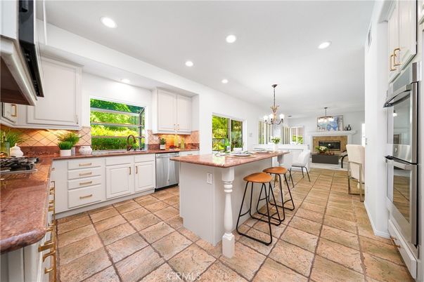 Chandelier, Fireplace, Interior, Kitchen, Pendant Lights, Recessed Lighting, Stainless Steel Appliances