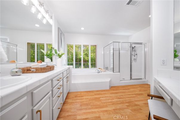 Bathroom, Dual Sink Vanities, Glass Shower, Interior, Recessed Lighting, Tile Countertops, Wood Texture Flooring