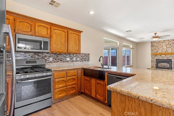 Interior, Kitchen, Recessed Lighting, Stainless Steel Appliances, Stone Walls, Wood Texture Flooring