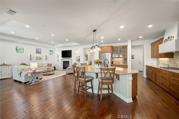 Dining room, Fireplace, Interior, Kitchen, Living room, Pendant Lights, Recessed Lighting, Stainless Steel Appliances, Wood Texture Flooring