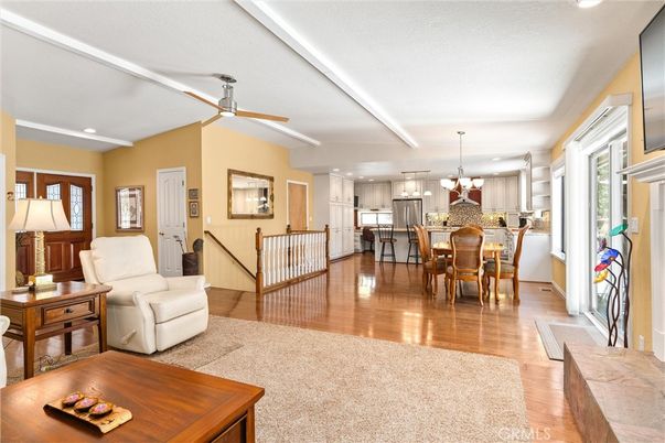 Chandelier, Dining room, Interior, Kitchen, Living room, Pendant Lights, Recessed Lighting, Stainless Steel Appliances, Wood Texture Flooring