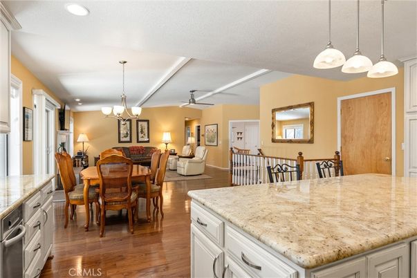 Chandelier, Dining room, Interior, Kitchen, Living room, Pendant Lights, Recessed Lighting, Wood Texture Flooring