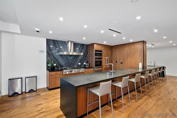 Interior, Kitchen, Marble Walls, Recessed Lighting, Stainless Steel Appliances, Wood Texture Flooring