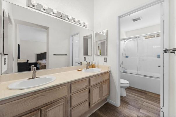 Bathroom, Dual Sink Vanities, Glass Shower, Interior, Wood Texture Flooring