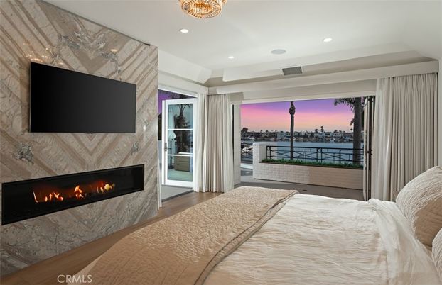Bedroom, Fireplace, Interior, Marble Walls, Recessed Lighting, Water, Wood Texture Flooring