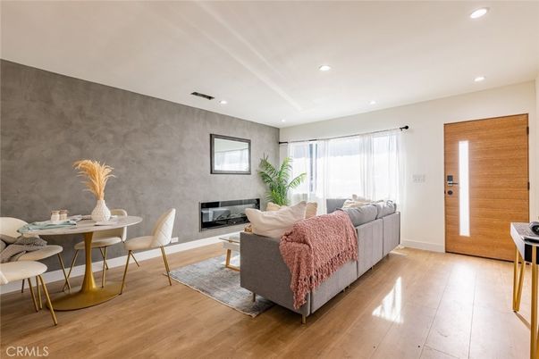 Dining room, Fireplace, Interior, Living room, Recessed Lighting, Wood Texture Flooring