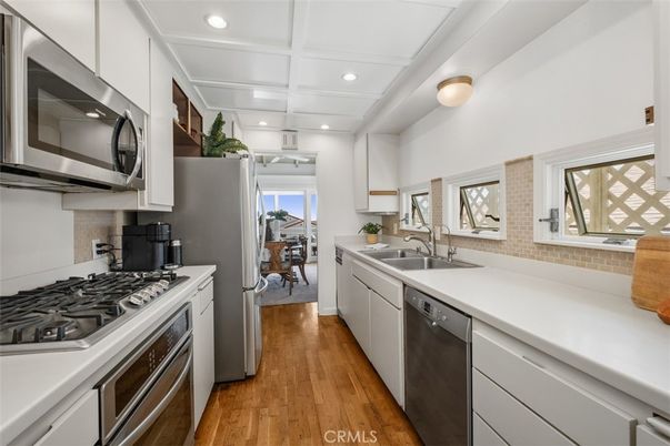Dining room, Interior, Kitchen, Recessed Lighting, Stainless Steel Appliances, Wood Texture Flooring