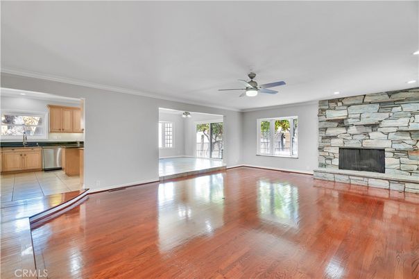 Empty room, Fireplace, Interior, Kitchen, Recessed Lighting, Stone Walls, Wood Texture Flooring