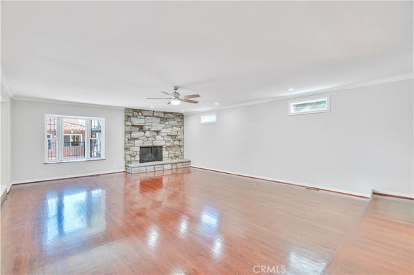 Empty room, Fireplace, Interior, Recessed Lighting, Stone Walls, Wood Texture Flooring