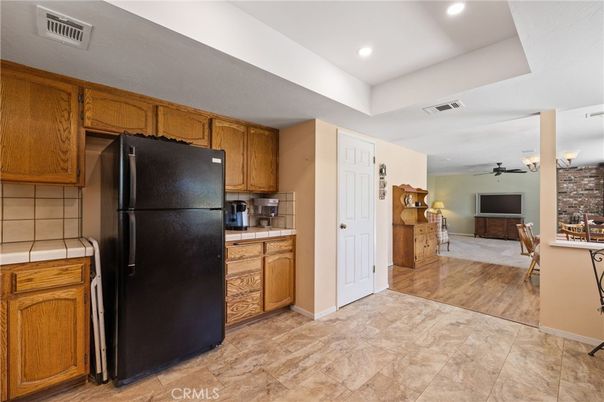 Interior, Kitchen, Recessed Lighting, Tile Countertops, Wood Texture Flooring