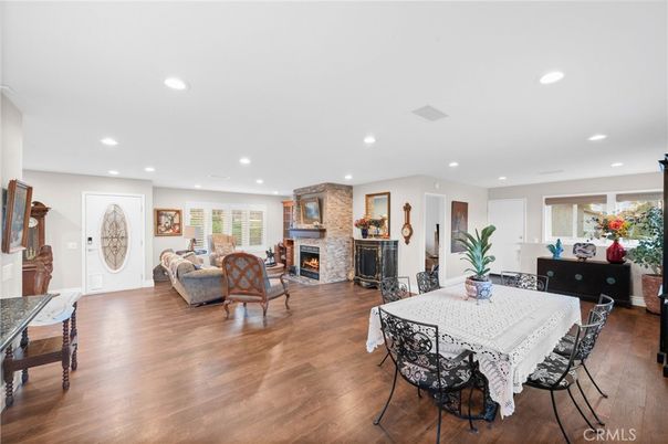 Dining room, Fireplace, Interior, Living room, Recessed Lighting, Wood Texture Flooring