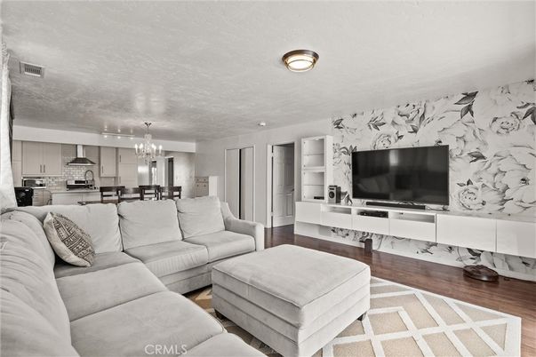 Chandelier, Dining room, Interior, Kitchen, Living room, Stainless Steel Appliances, Wood Texture Flooring