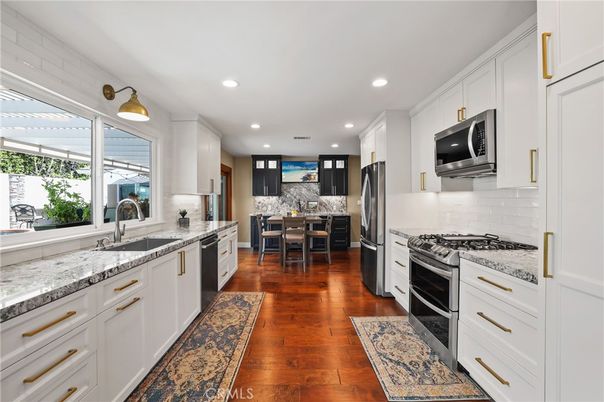 Dining room, Interior, Kitchen, Recessed Lighting, Stainless Steel Appliances, Wood Texture Flooring