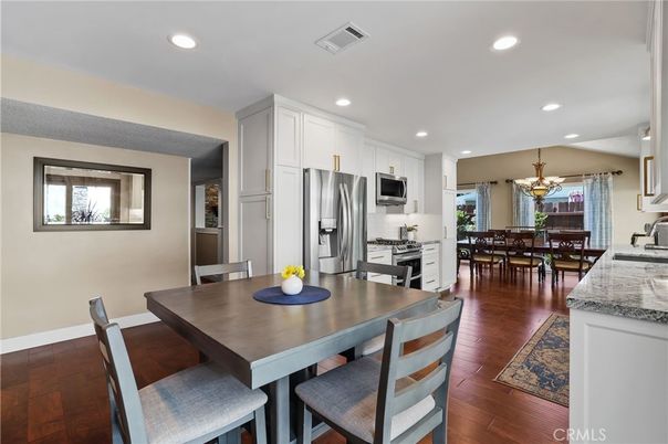 Chandelier, Dining room, Interior, Kitchen, Recessed Lighting, Stainless Steel Appliances, Wood Texture Flooring