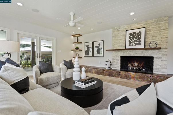 Fireplace, Interior, Living room, Recessed Lighting, Stone Walls, Wood Texture Flooring