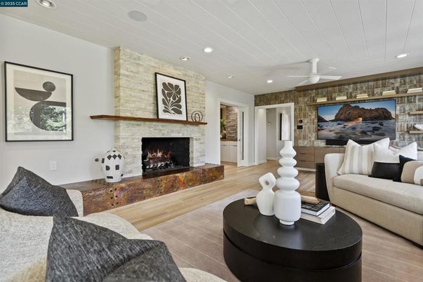 Fireplace, Interior, Living room, Recessed Lighting, Stone Walls, Wood Texture Flooring