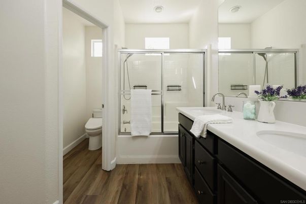 Bathroom, Dual Sink Vanities, Glass Shower, Interior, Wood Texture Flooring