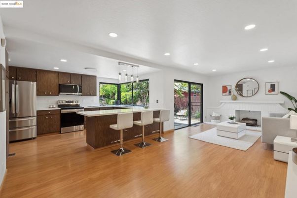 Fireplace, Interior, Kitchen, Living room, Pendant Lights, Recessed Lighting, Stainless Steel Appliances, Wood Texture Flooring