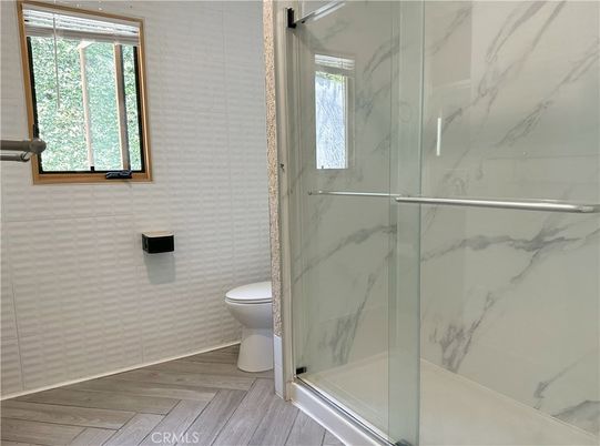 Bathroom, Glass Shower, Interior, Marble Walls, Wood Texture Flooring