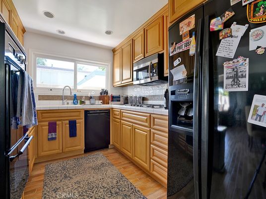 Interior, Kitchen, Recessed Lighting, Tile Countertops, Wood Texture Flooring