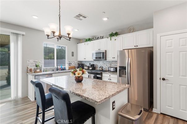 Chandelier, Interior, Kitchen, Recessed Lighting, Stainless Steel Appliances, Wood Texture Flooring